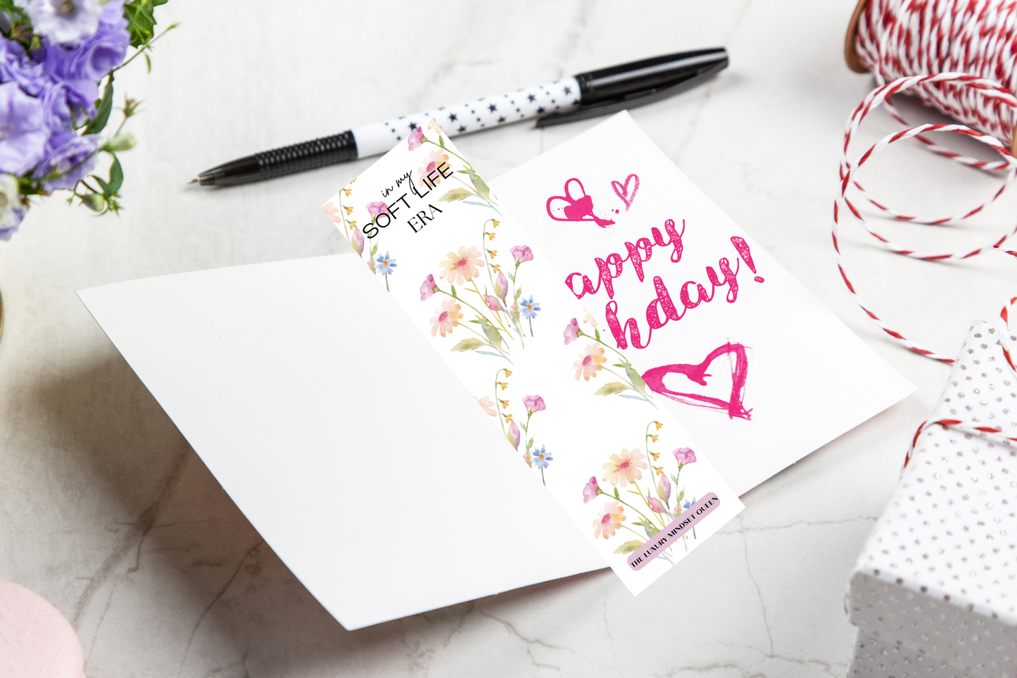 Elegant printable bookmark with soft floral design styled in an open Birthday Card.