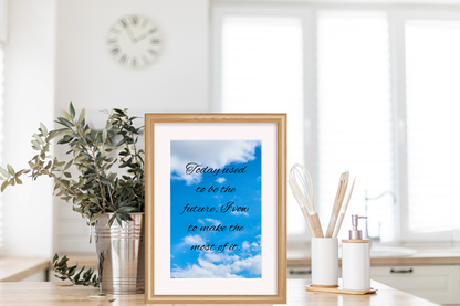 Framed motivational quote wall art "Today used to be the future" displayed in a modern kitchen with minimalist decor.
