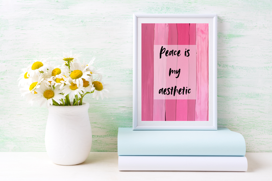 Pink affirmation art print styled above a bedroom dresser with minimalist furniture.