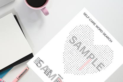 Sheet of paper with a self-care word search on a desk with a mug and notebook.