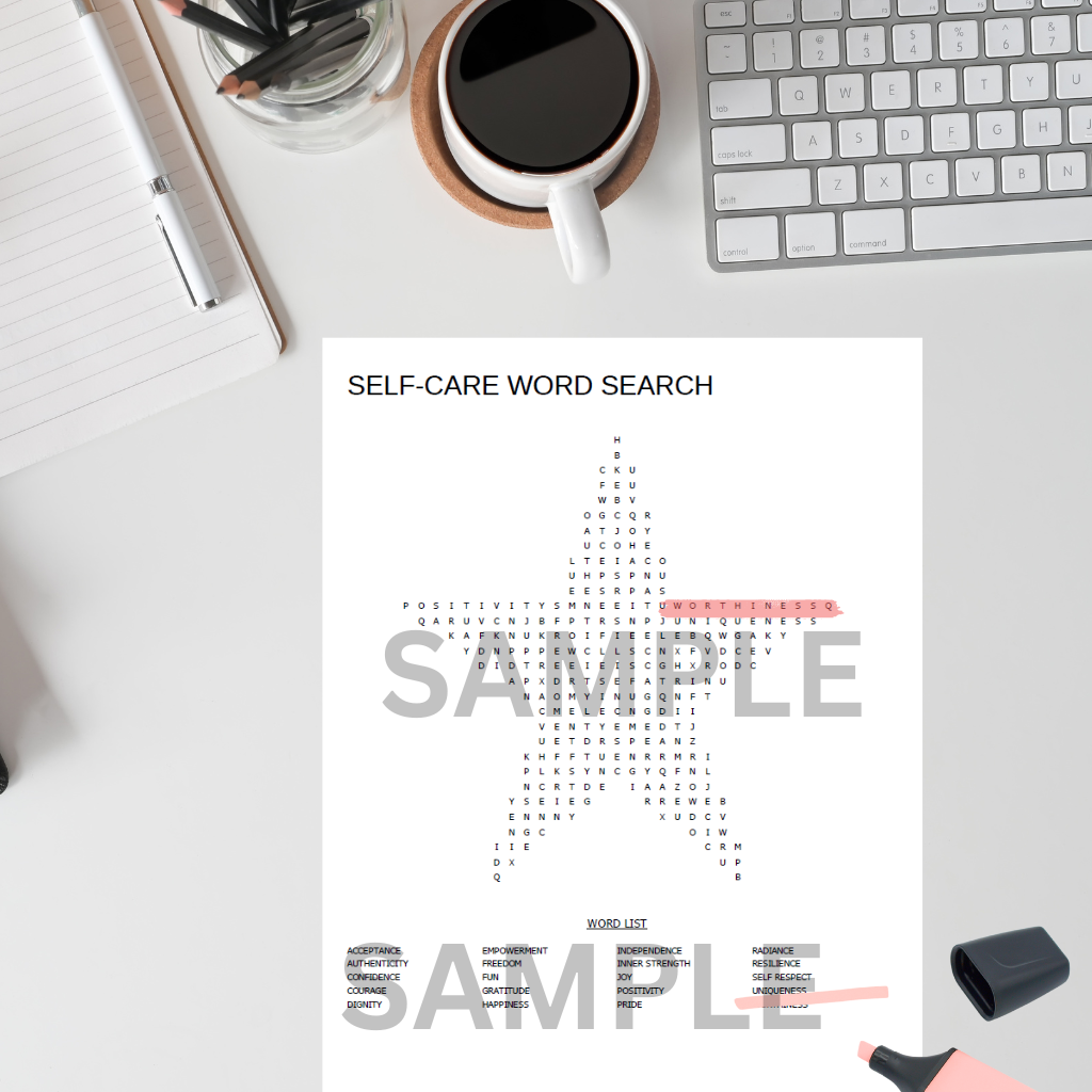 Star-shaped self-care word search printable styled on a modern feminine desk with a stationery and and laptop