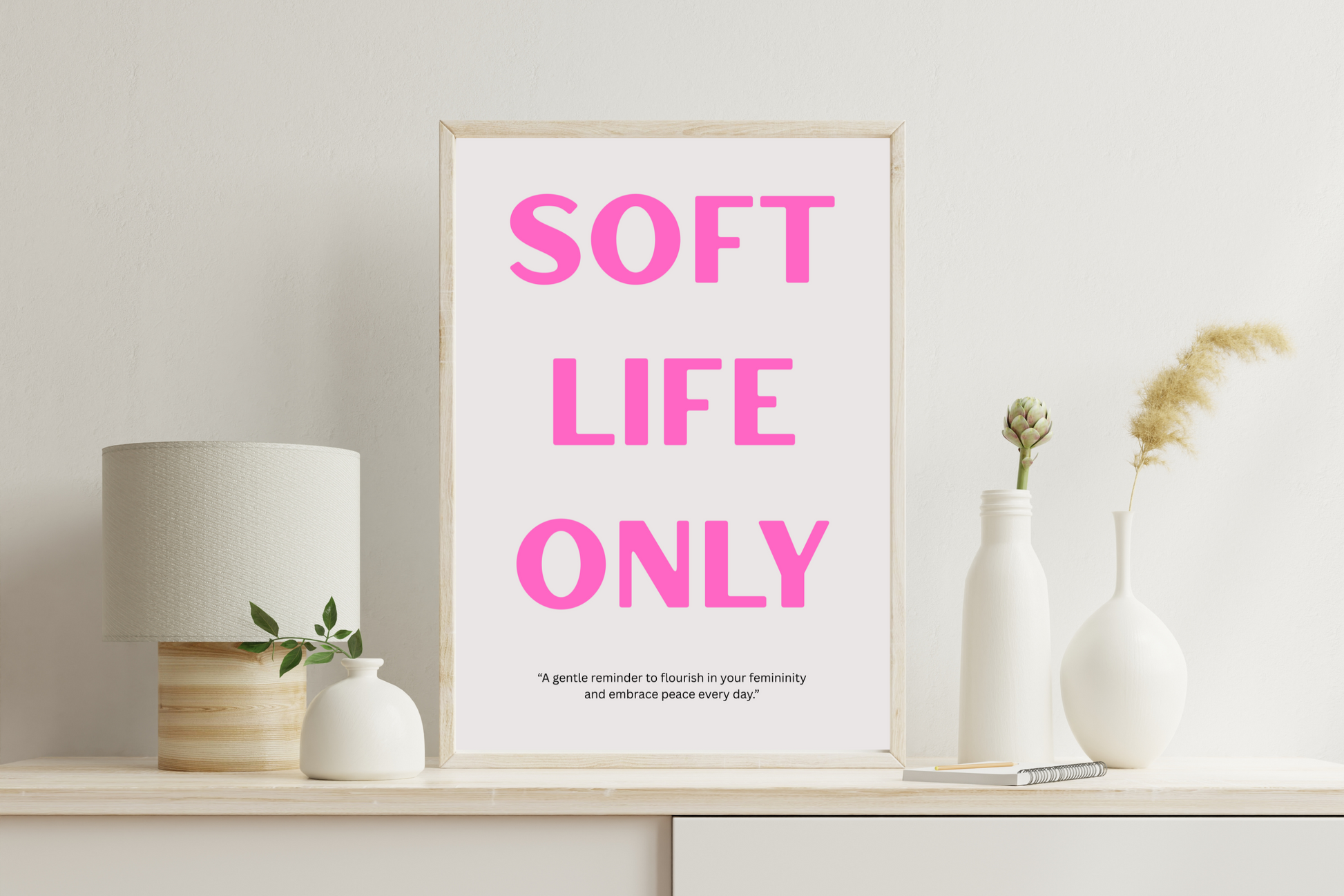 SOFT LIFE ONLY printable wall art poster with pink typography on grey background displayed in a modern living room
