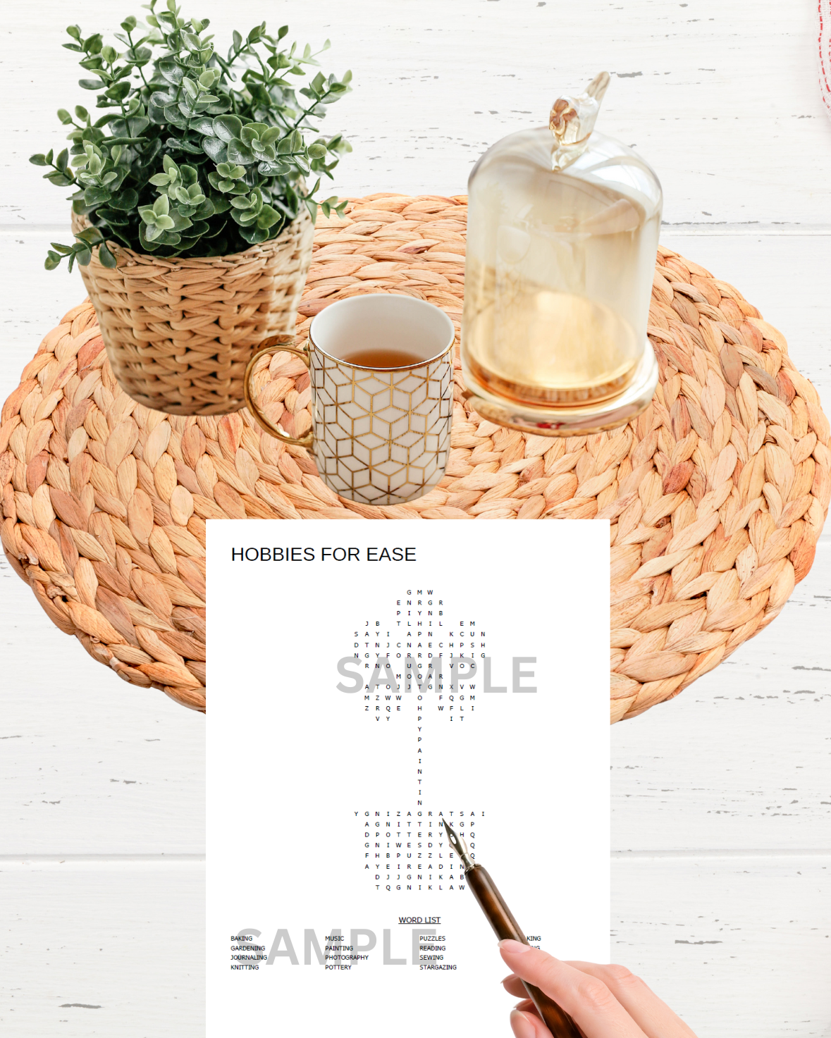 Round woven table with a cup, plant, and glass on top, featuring a 'Hobbies for Ease' word search sheet.